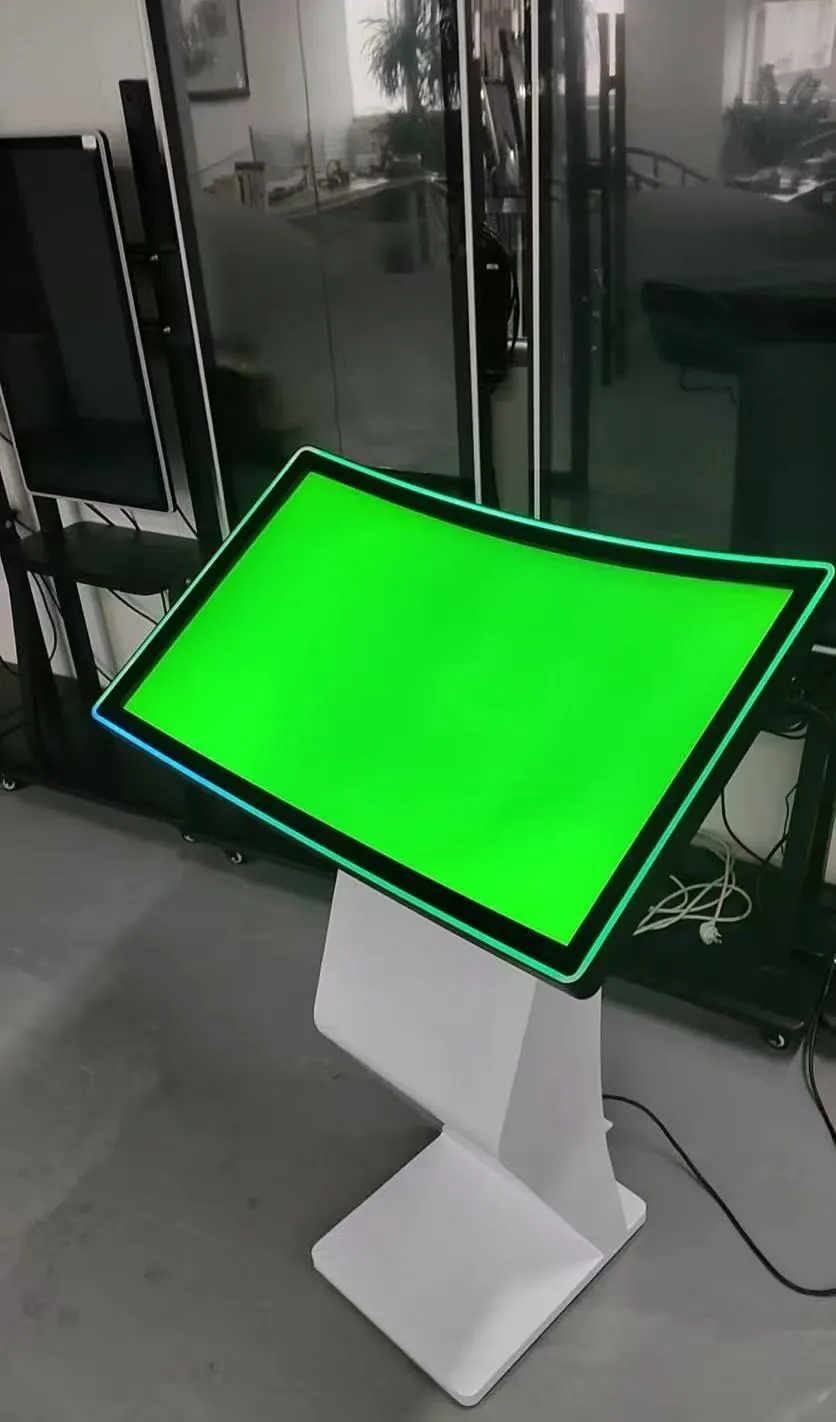 32-inch touchscreen kiosk display in retail environment showing modern design, high-quality display, and user interaction with capacitive touch technology